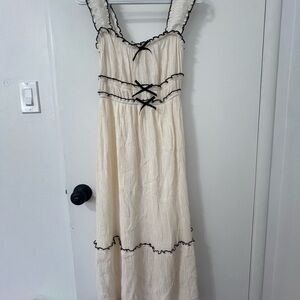 Elegant Cream Dress with Black Accents